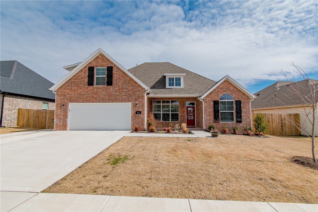 Beautiful 1 year old home with 4 bedrooms/3 full baths. Large open concept plan with split bedrooms. Large Bonus room upstairs with full bath. Oversized garage has work station of upper and lower cabinetry. Nicely landscaped yard with storage building to convey. Great neighborhood community. 10 mins to U of A, NWA Mall and Washington Regional.
