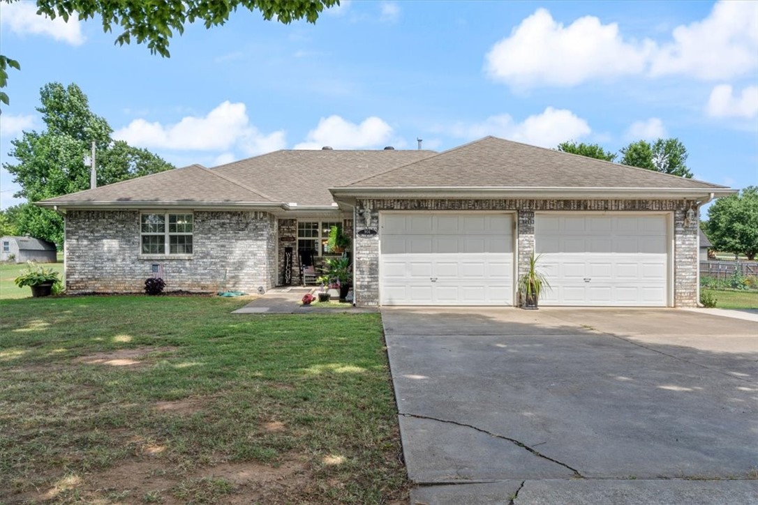 Nestled in the heart of Huntsville, AR, this custom-built 2-bed, 2-bath home spans 1,518 sq ft and exudes charm and modern comfort. Boasting a prime location opposite the Madison County walking trail and future splash pad, outdoor enthusiasts will delight in the scenic surroundings. The property features a beautifully landscaped nearly half-acre lot with a spacious yard and a convenient 10x20 metal storage shed. Enjoy the serene heated and cooled sunroom year-round. Recent upgrades include a new roof (June '24) and new blown insulation (Sep '23), ensuring energy efficiency year-round. With an oversized driveway perfect for an RV, easy access to Highway 412, and proximity to local schools, convenience meets serenity. Just 35 minutes from historic Eureka Springs and Northwest Arkansas, this home offers the perfect blend of suburban tranquility and urban accessibility.