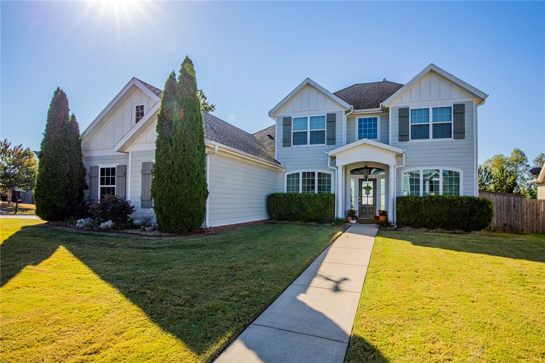 Welcome HOME to Hyde Park. This craftsman style home boasts 4 bedrooms + office/formal dining with an open concept floor plan. Living room features hardwood floors, gas log fireplace & vaulted ceiling with beams. Kitchen has beautiful white cabinets, SS appliances, gas cooktop, granite countertops & farmhouse sink. Great back yard with privacy fence and covered patio with a side load 3-car garage sitting on a large corner lot. Located in Bentonville school district. Awesome community with pool, playground and a garden.