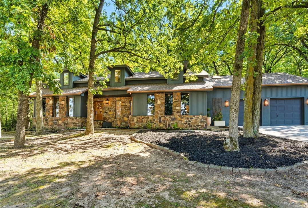 Welcome to this spacious east Fayetteville residence offering 3561sqft with thoughtful upgrades throughout. Nestled on over an acre lot & less than a mile from some of the most sought-after schools, this home blends elevated design details and everyday functionality. The primary ensuite delivers luxury with a spa-worthy wet room, double vanities, and a makeup vanity. Two options for the primary bedroom ensuite ensures comfort and privacy for family and guests. The gourmet kitchen is a chef’s dream, featuring an 11' island, 48" duel-fuel range with double oven, and an expansive walk-in pantry. Cozy reading nooks, a dedicated office, and a flexible bonus room cater to relaxation, work, & play. Two fireplaces -one in the main living area and one in the primary bedroom- add warmth & charm, while the bedroom side porches extend your living space outdoors. There is also a basketball pad, play area, and pickle ball area for fun! This home provides the feel of seclusion within your home while still being very convenient!