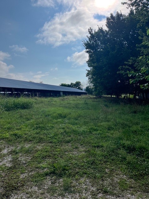Donāt miss this opportunity. 3.5 Acres available minutes from downtown Farmington or Prairie Grove. Lot includes 2 solid, well-built, metal trussed, open barns. 3rd barn split with space allotted as a workshop, green house, and storage. Water, natural gas, and electricity on site. Buyer can remove barns or retrofit for equine/livestock stalls or use as the perfect centralized location for large commercial equipment storage. Additional adjacent acreage available to create the perfect ranchette! Agent Owned - Also see MLS# 1314861