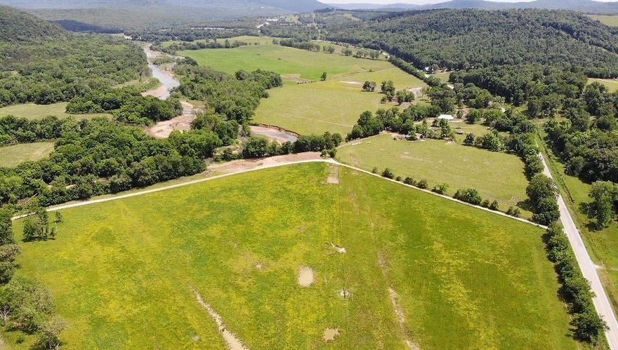 This land has over ½ mile frontage on the well-publicized “PIG TRAIL.”, and lays on both sides of beautiful White River. Plenty of land not in flood plain for construction. Several barns and sheds on site under use and also a dwelling built in 1895 that has no value (sellers will make no repairs, sold as is).  One parcel, 37.02 acres, is accessed over a private property access road by a deeded easement, it was an old wagon road and fords White River. Access through locked gates only after accepted offer. Come view property and let your imagination run wild!