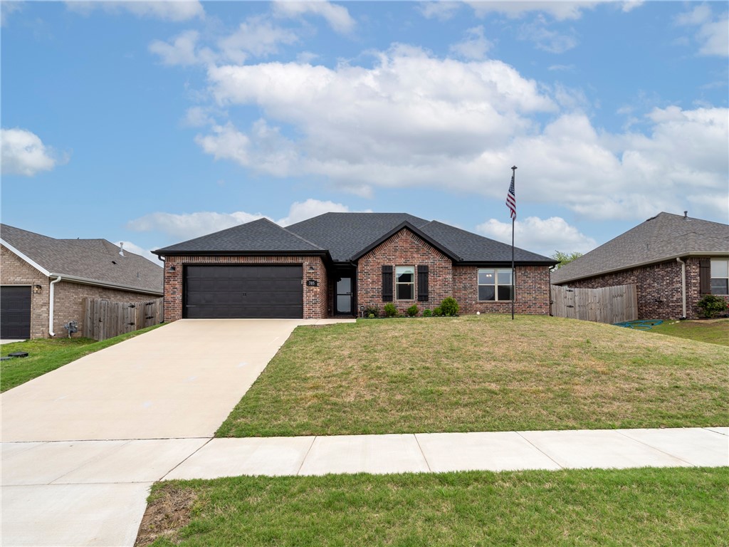 Better than new 1 year old home with upgrades. Living room features an elegant fireplace that extends tilework to the ceiling. Features an open floor plan. Kitchen island seating. The kitchen is equipped with granite countertops, stainless steel appliances, and pantry. Enhanced with smart technology, the home includes a ring doorbell and google nest thermostat. Abundant windows in the living room and master bedroom provide natural light. A fully tiled shower and a whirlpool tub. Spacious closets. Two high quality storm doors have been added along with a flagpole. Custom Shades. Curtains are negotiable. Covered patio and privacy fence in the backyard. You don't want to miss seeing this excellently maintained home.