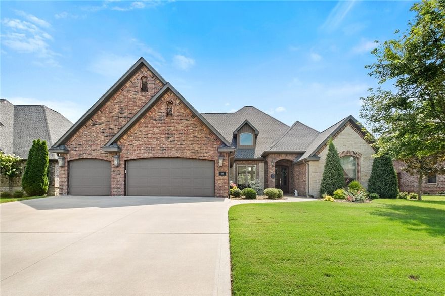 Nestled in the serene & desireable Woods Creek community, this home offers an idyllic blend of luxury & comfort. Wooded views offer tranquility & ample privacy thanks to meticulously placed trees surrounding the expansive backyard, complete with a custom flagstone patio. Minutes to Downtown Bentonville, Crystal Bridges, & the new Wal-Mart Campus, this home combines convenience w/the beauty of nature. Easy access to I-49 enhances any commute. 4 spacious bedrooms plus office & bonus room w/wet bar. White oak flooring adds warmth & elegance. The kitchen is a chef’s delight! Double ovens, gas cooktop, & corner pantry. The primary suite is a retreat unto itself, boasting a spacious layout, en suite bathroom w/soaking tub, fully tiled walk-in shower, private water closet, & large walk-in closet w/radiant natural light. Entertaining is effortless both indoors & out. Whether relaxing in the backyard oasis or hosting gatherings in the beautifully appointed living spaces, every corner of this home is designed for enjoyment.