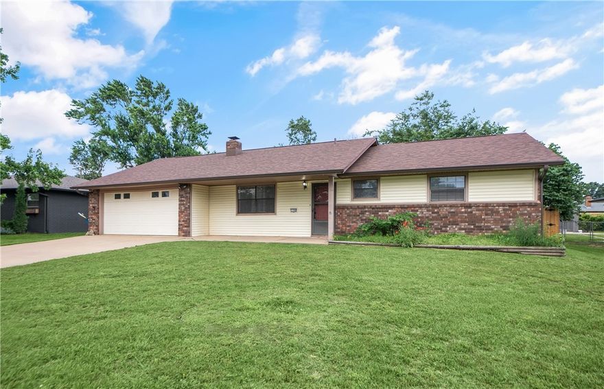 Charming 3-bedroom, 2-bath home on a spacious 0.25-acre lot, just minutes from the new Walmart Campus! With 1,622 sq ft of living space, this home offers recent upgrades including a new roof, skylights, and fencing (2024), plus a new breaker box and updated electrical outlets (2022). A 12x16 insulated outbuilding has been transformed into a functional office with a window A/C unit—perfect for remote work or hobbies. An additional 10x14 storage shed provides ample space for tools or gear. Located close to the Razorback Greenway which is 40 miles of paved bike trail.  This home is ideal as a personal residence or investment property. Don't miss this opportunity to make it your own!