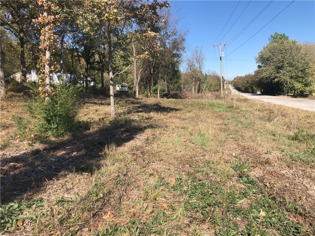 Great mixture of timber and open land. Good view of valley. Farmland. Enjoy your wildlife, country life, view and all this on paved road. Water tap is available to purchase and water line is on east side of Wedington Road.