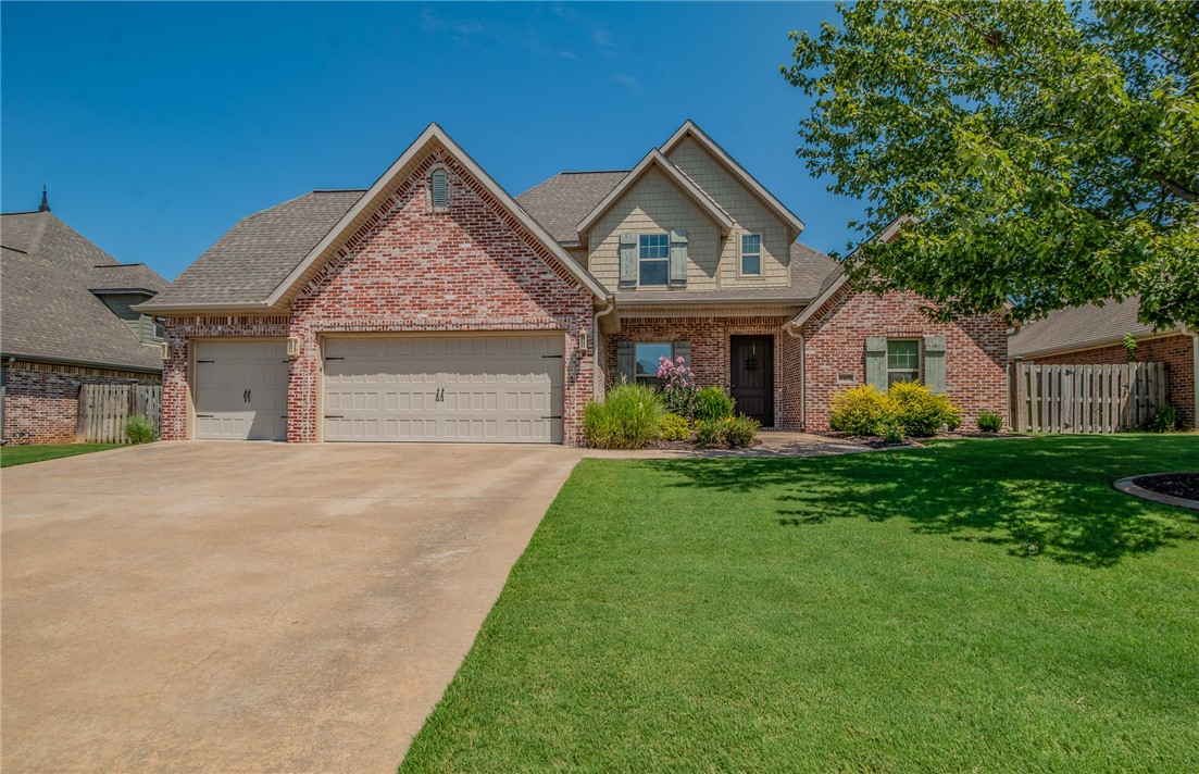Live in one of Rogers’ most sought-after neighborhoods with schools, shopping, and amenities just minutes away. This 4-bedroom, 2.5-bath home offers nearly 3,000 sq. ft. of thoughtfully designed living space with high-end finishes throughout. The open-concept main level features a spacious family room and chef’s kitchen with 3 cm granite countertops, custom cabinetry, sunny breakfast nook, and dining room for gatherings. The main-level primary suite is a private, generous retreat with spa-like bath and spacious walk-in closet. Upstairs, three additional bedrooms, a full bath, and expansive bonus room provide a versatile space for a playroom, home office, exercise room, or media lounge. Outside, the covered patio and outdoor fireplace create the perfect setting for entertaining. The neighborhood amenities of a pool and playground make life even more enjoyable. With Fairview Elementary, shopping, and entertainment just around the corner, this home blends luxury, comfort, and convenience in one perfect package.