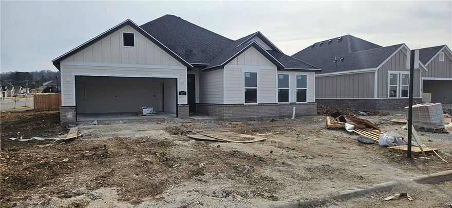 Great new construction home in Towne West S/D. The 'Arkansas' plan features 3 bedrooms, 2 bathrooms, wood floors, quartz countertops, split floor plan, stainless steel appliances in kitchen, LVP flooring, linear fireplace in large living room, open kitchen with pantry, large master suite complete with huge walk in closet, separate shower & Jacuzzi tub with double vanity. Covered back patio, fenced in yard, & much more! Come take a look!