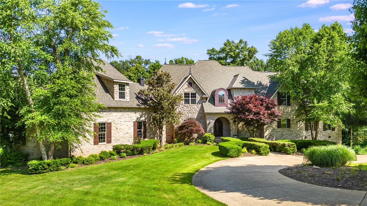 Welcome to Maple Manor ā a luxurious private estate surrounded by natural beauty. This serene retreat features a soaring great room with floor-to-ceiling windows, a high-end custom kitchen with top-tier appliances, and a spacious multigenerational layout. The primary suite offers a stunning closet and attached nursery. Enjoy a home theater, separate guest apartment, wine cellar, and an outdoor oasis with heated gunite pool, waterslide, hot tub, fireplace, and seating area. NEW roof (2021). Seller offering $50K in concessions to personalize your dream home!