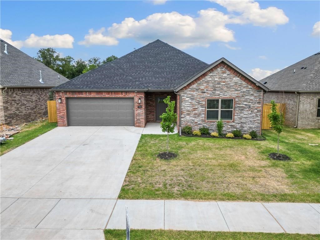 This all brick home with stone accents features custom cabinets, wine racks, a spacious pantry, a master bath with tiled walk, in shower, rain head and wood flooring. Extras include faux wood blinds, gutters, privacy fence, washer, dryer and fridge. Located near Bentonville schools, it requires a minimum one-year lease, background and credit checks and renterās insurance.