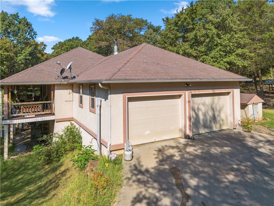 Discover the perfect blend of quiet country living and prime accessibility at 9039 Grand Prairie Road in Charleston, Arkansas. This spacious property offers over 3,000 sq. ft. of comfortable living space, a walk-out basement, 40 beautiful acres, and a 2,400 sq. ft. insulated shop—providing endless opportunities for recreation, business, or multi-use living. 
Charleston is a welcoming small town known for its strong sense of community, excellent schools, and relaxed lifestyle. Located just minutes from Highway 22 and quick access to I-40, this property offers an ideal location for out-of-state buyers seeking privacy without sacrificing convenience. Fort Smith is only a short drive away, offering major shopping, dining, medical facilities, and employment opportunities. Fayetteville and the Northwest Arkansas corridor are also within easy reach for commuting, weekend trips, or entertainment.