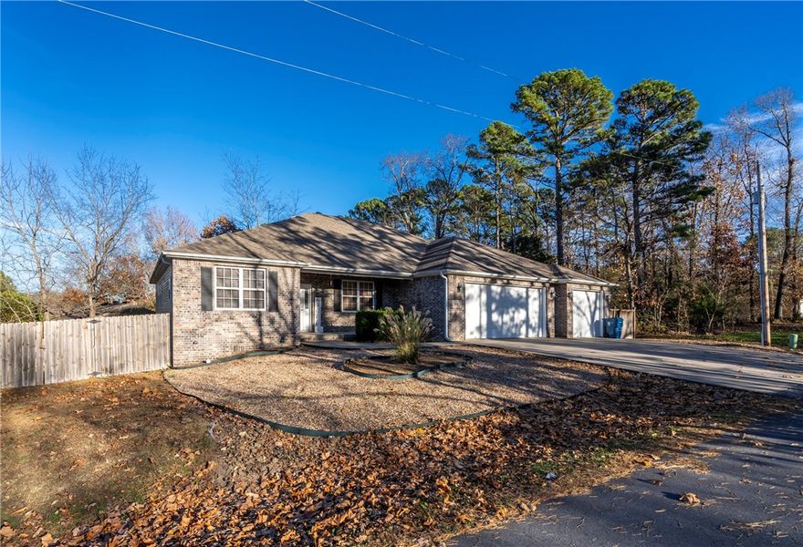 Step inside to a spacious open-concept living area featuring a cozy fireplace, ideal for relaxing evenings.  The split floor plan ensures privacy, with the large primary suite thoughtfully separated from the additional bedrooms.  The primary bedroom includes a comfortable sitting area, a luxurious en-suite bath, and an expansive walk-in closet.  The kitchen is a chef's dream, showcasing granite countertops, a large prep island, and ample cabinet space for storage.  A bonus room, currently being used as a fourth bedroom offers flexibility for a home office, playroom, or guest space.  Outside, the three-car garage provides plenty of room for vehicles, storage, or a workshop set up.  The covered back deck offers a place to enjoy summer evening cookouts or morning coffee.