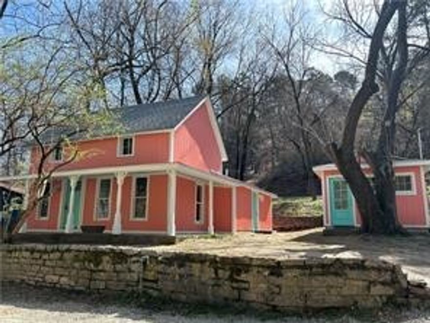 Eureka! Your Ozark Goldmine Awaits at 88 Grand Avenue! Excellent Investment Property! Charming home that has been completely remodeled as well as the adorable guest cottage that is located on the property in downtown Eureka Springs. New Roof, plumbing, electric, water & sewer line, siding, HVAC, hot water heater and so much more! Hardwood and Tile Floors, french drain system, surface drain system and new 200 amp service. The main home consists of 2 Bedrooms and 2 baths as well as a spacious living room and kitchen. Tons of windows throughout! The cottage is a studio plan with wonderful windows and the cutest little kitchen. Perfect for a long term rental! Walk to historic downtown, the library and all that Eureka Springs has to offer!