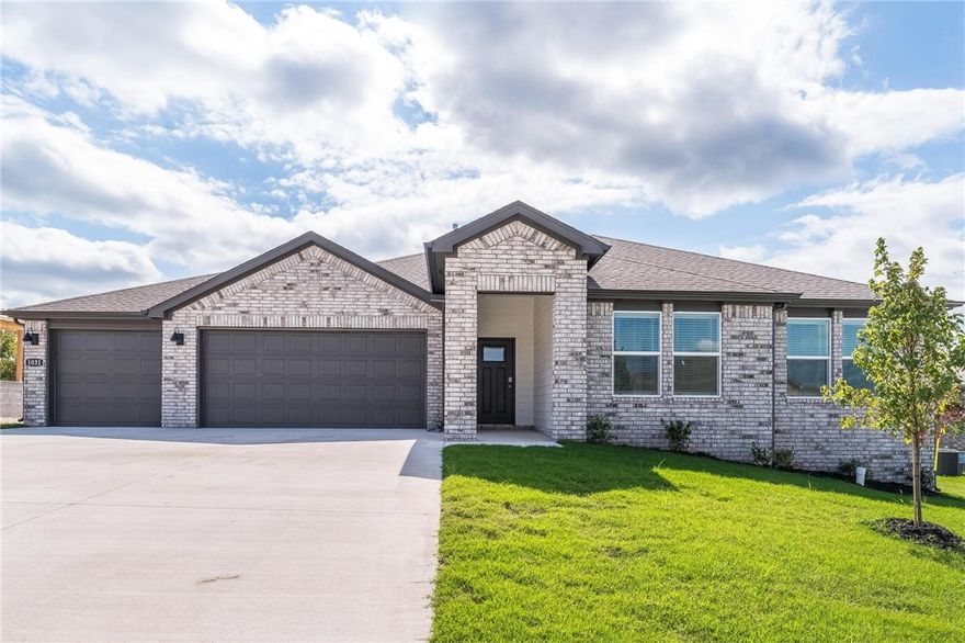 Available now! Beautiful 4BR/2BA home with 3-car garage in Hudson Heights, Prairie Grove. This new build offers quartz counters, stainless appliances (fridge, washer & dryer included), gas range, pantry, and open layout with luxury vinyl plank flooring. Living room features an electric fireplace for added comfort. Primary suite includes dual sinks, oversized walk-in shower & large walk-in closet. Covered patio ideal for relaxing or entertaining. Keyless entry provides added convenience. This smart home includes a video doorbell, smart thermostat, smart garage opener, and Alexa-all available to control by phone once tenant sets up Wi-Fi. Convenient location with quick access to Hwy 62, just west of Fayetteville/Farmington. Minutes from Prairie Grove Battlefield State Park, Aquatic Park, antique shops, cafés, and Razorback Greenway trailheads. Short drive to Fayetteville's dining, shopping & University of Arkansas. Move-in ready-don't miss this one!