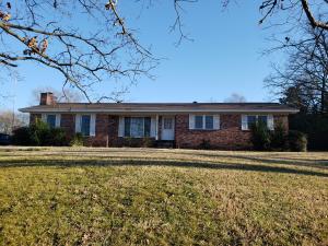 Hilltop setting with a spacious home. 3 bedroom 2.5 bathrooms and 2 living areas, one complete with a fireplace. Storage / workshop off of the 2 car carport and an additional storage building. 2.98 acres to enjoy and use.