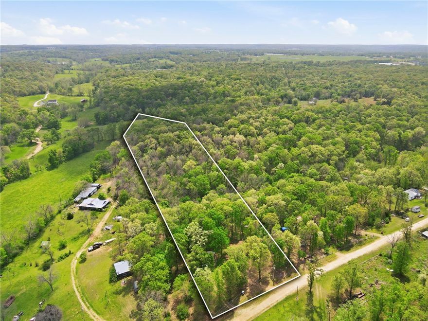 Almost 6 acres and utilities in place! Welcome to 15435 Realtree Rd, where you’re getting more than just land… you’re getting a head start. Utilities are already in place, saving you time, money, and hassle from day one.

Tucked away for privacy but still incredibly convenient, this property is just 13 minutes to downtown Centerton and about 22 minutes to Bentonville—giving you that perfect balance of peaceful living without feeling disconnected.

Yes, the mobile home needs work—but that’s where the opportunity shines. Renovate it and live on-site while you build your dream home, bring in a new double-wide, create a custom build, or design the perfect tiny home retreat. The groundwork is already here—just bring your vision.

If you’re looking to build, or create your own homestead, this property checks the boxes in a big way.
Financing will need to be land or construction loan. NO RD / FHA LOANS. Property is being sold as-is, with no repairs. Centerton water and Carrolton electric.