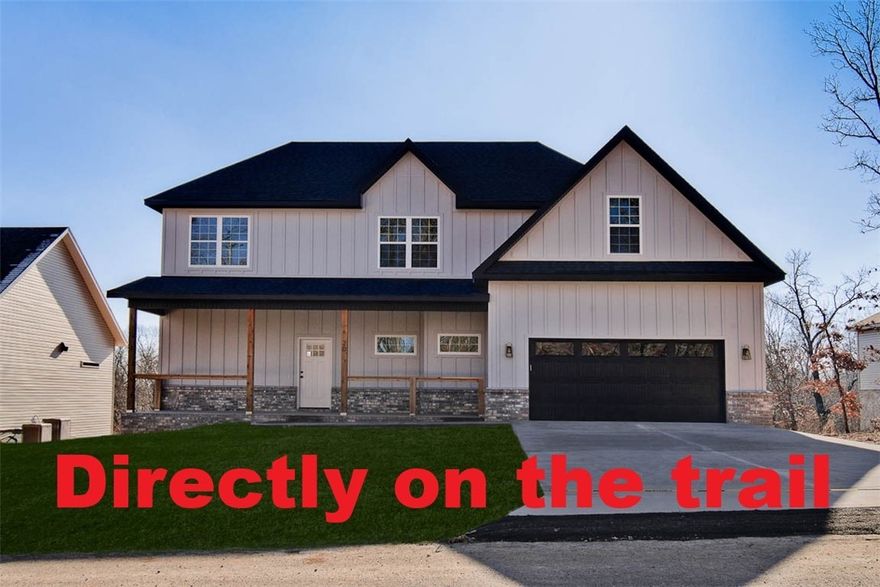 New construction with a bonus room on a wooded lot directly on the bike trail! This stunning property offers the perfect blend of nature and nearby amenities. Conveniently located a few minutes to Lake Ann and close to the Back 40 Trailhead. Step inside to discover wood floors, a beautiful fireplace, custom cabinets, and elegant 3 cm quartz countertops. The expansive kitchen and gas range is perfect for culinary creations. This thoughtfully designed home features 3 spacious bedrooms plus a versatile bonus room, providing ample space for entertainment. The primary bedroom is conveniently located on the main level. Bentonville schools! As an added bonus, this home includes $3,500 in buyer's closing costs when using the builder’s preferred lender!