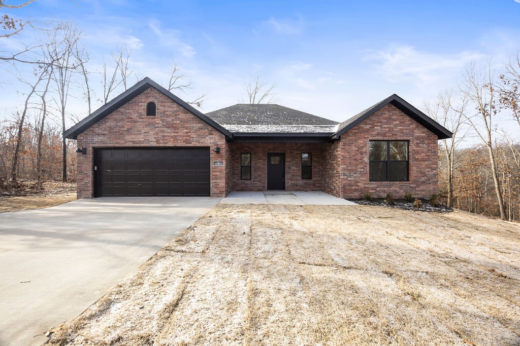 Very close to Branchwood Rec Center featuring a scenic 1.6 mile paved nature trail, pickleball courts and indoor pool. Also close to Loch Lomond's Stoneykirk Boat Launch and Highlands Golf Course and Pub. Easy access to 1-49 and all things Northwest Arkansas. Come enjoy this NEW home on a large lot with privacy and a neighborhood feel. Home's interior features an open layout with a large granite island, stainless steel appliances, and a pantry. Ventless gas fireplace. LVP flooring throughout. Dedicated laundry room. Hot Water recirculation system. Elevated deck overlooking the backyard's beautiful view. Builder offers a TWO YEAR warranty. *All photos - interior and exterior - are of a previous home by the builder with the same layout and similar finishes. *4th room to be considered an office/flex room. This lot will be deeded as a 3-bed septic. Acknowledgment of this fact to be submitted with offer.*