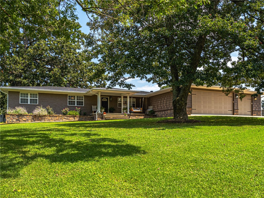 Prime Location: Bentonville Schools, Bentonville West HS, just 2 miles from I-49 and 8 miles from Downtown Bentonville!
Welcome to this stunning 2,209 sq.ft. home boasting a bright, open floor plan! This property offers:
Elegant built-ins, durable Pergo flooring, and brick/vinyl shake siding
3-car garage, and a cozy wood-burning fireplace with steel liner & blower
Converted garage transformed into a versatile, climate-controlled spaceāideal for a bonus room, gym, office, or additional bedroom
Ample storage with a safe room/tornado shelter in Garage
Large swimming pool, one of kind slide and hot tub
Beautiful 1.02-acre lot with mature shade trees, gardening beds, fruit trees, porches, and decks
Fully fenced with a well house (public water option available; owner enjoys abundant, high-quality well water) Unique Opportunity: Previously a highly successful Airbnb, consistently fully booked! As-Is Sell
