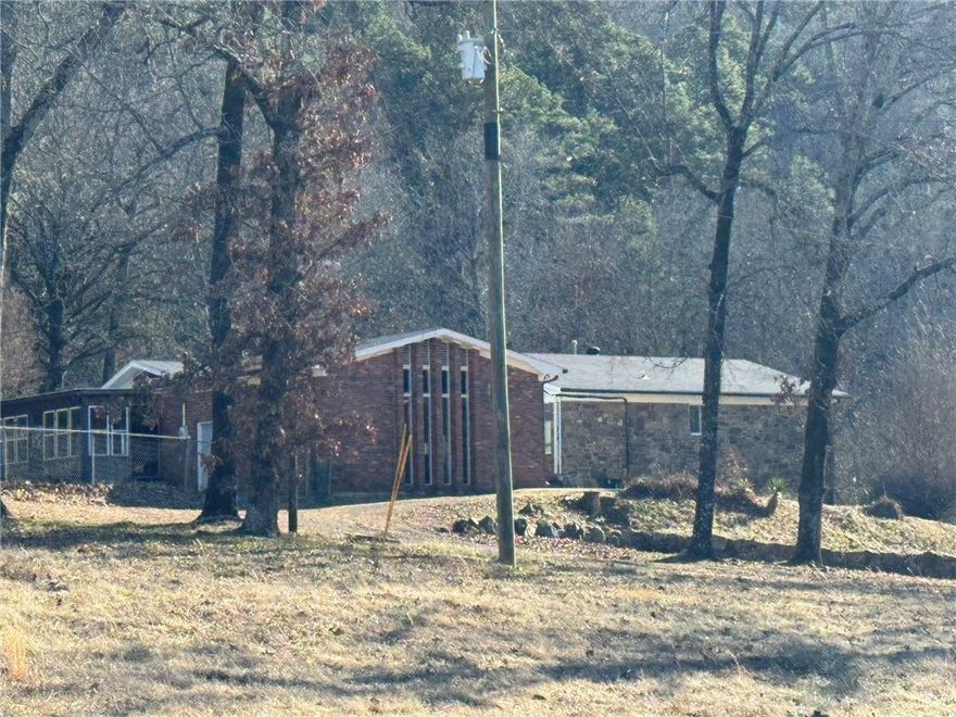 Discover the perfect blend of spacious living and rural tranquility on this remarkable 11-acre property. This impressive 4,674 square foot home offers abundant space with 5 bedrooms and 3 bathrooms, ideal for large families or those seeking room to spread out.
The property sits privately among mature hardwoods, providing a serene, natural setting while maintaining convenience to area amenities. The thoughtful layout maximizes the generous square footage, offering flexibility for home offices, guest suites, or multi-generational living.
A standout feature is the substantial 25' x 40' shop building (1,000 sq ft), perfect for hobbyists, contractors, or equipment storage. Whether you're managing a business, pursuing automotive projects, or need secure storage for vehicles and equipment, this workshop provides exceptional functionality.