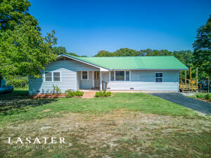 Located in the Ozark Mountains you will find this wonderful property only 3 minutes away from the Buffalo National River that features 4 bedrooms, 1.5 baths, a 1,500 shop building with electric, 3.83 partially fenced acres with no restrictions, the original homestead, another shop building with electric and an additional outbuilding. The views from the newly finished deck are breathtaking! Additional features you will love; original hardwood flooring, big picture windows, back up heat source, the large living room and dining room that has recently been added bringing the square footage up to nearly 2,000 and the asphalt driveway! This property is the Ozark mountain getaway you've been looking for! Make this your hunting cabin, your hobby farm residence, your rental or vacation home