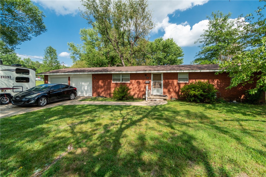 Solid brick home on a half-acre with easy access to both Springdale and Fayettevilleālocation makes the difference here. Whether you're starting out or scaling back, this place checks the right boxes with a manageable yard, functional layout, and simple charm that feels like home.