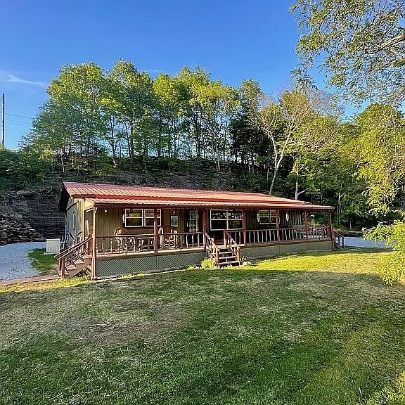 LOCATION, LOCATION, LOCATION! Everyone wants something between Jasper and Ponca. Here it is! This private 1484 SF 3 BR 2 BATH setting on 3.29 ac at Low Gap, Arkansas in the heart of the Upper Buffalo National River Region in beautiful Newton County, Arkansas. Located just 4.3 mi from Steel Creek Access & 4.5 miles from Ponca Access of the Buffalo National River. Features of the home include an updated kitchen, guest bath, bamboo floors, covered front porch, back deck, side deck, central HVAC with Wi-Fi smart thermostat, wood stove, 12Kw Kohler propane backup generator & 26'x20' shop/garage. Located 10.1 mi from Jasper off Hwy 74W with no dirt road but secluded with no homes in site. Near the Ozark National Forest. Just a short drive from Russellville, Harrison, & Fayetteville. This central location is convenient to the best swimming holes, hiking, bike riding, canoeing, wildlife photography, ATV riding & fishing. Other nearby outdoor activities include horseback riding, mountaineering, caving, & scenic driving.