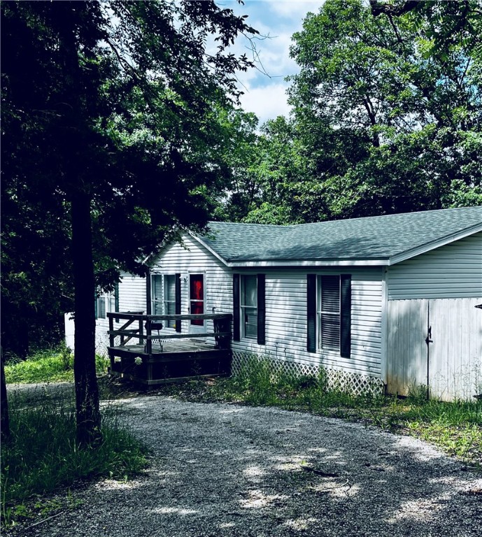 Home on a corner lot, close to Missouri state line. This 4 Bedroom, 2 Bathroom home has a fenced in backyard, circular driveway, and more room on the other side for parking. Nice big kitchen with dining room. Laundry Room with doorway going out to the deck. Home needs a little work, but with some improvements, this could be the ideal home for anyone! Home is being sold AS-IS.