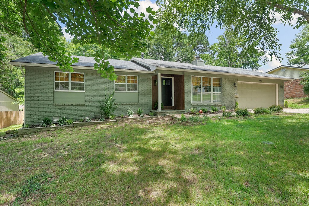 Don't miss this recently remodeled, new everything including new exterior paint, East Fayetteville hidden gem tucked in a cul-de-sac in the Vandergriff School District. As you enter you will see fresh paint on everything and new flooring throughout the home. The large inviting living room has a cozy wood burning fireplace and reading area in front of a large window making this the perfect room for relaxing. Proceed to the new modern kitchen featuring a new cabinets, quartz counters and stainless appliances with a commercial exhaust. Off the kitchen is the lounge "Bat Cave" which would make a great area for the family to hang out, kids to play or an office if you work-at-home. Down the hall you will find the primary bedroom at the back of the home with a brand new ensuite. Two more bedrooms off the front of the home and a second new bathroom wrap up this hidden gem. Recharge your batteries on the back deck watching the kids and pets play in the expansive flat, fenced backyard. Brand new roof will be done this week.