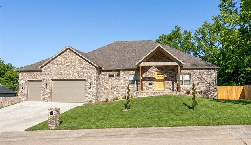 Experience refined living in this 2024 custom-built estate on 1.1 acres in Rogers. This exceptional residence features 4 bedrooms and 4.5 baths, including a private office and a grand bonus room. The lower level has been transformed, replacing the former mancave with a dedicated in-law suite complete with its own full bath. An additional private movie room and a versatile flex space, en-suite (functioning as a 5th bedroom), provide unmatched flexibility.  Premium finishes include custom white oak soft-close cabinetry and a JennAir built-in fridge/freezer with matching oak panels. Vaulted living, kitchen, and dining spaces center around a striking 10x5 quartz island. The primary suite features a fireplace, dual rain showerheads, and a 6x4 custom jacuzzi. Enjoy two stories of over 700 sq ft of covered patios with composite decking and a cedar-fenced-in yard. The oversized, insulated 3-car garage features 10' doors and 15'4" ceilings. Fiber internet and a gas cooktop complete this luxury retreat.