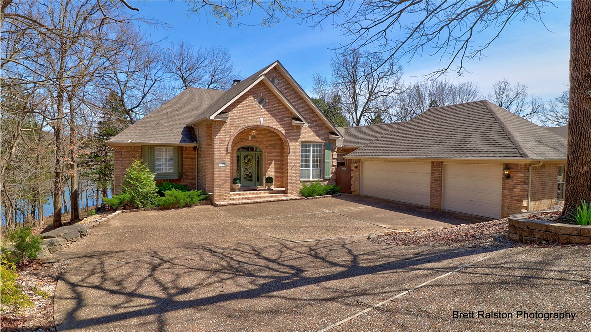 Beautiful lakefront home with gentle walk to water, professionally landscaped with irrigation for back area, and lots of outdoor living areas for entertaining! Interior has open floor plan, large kitchen with dining. Large master with view of lake, large master bath with double walk-ins, updated shower and vanities. Walk-out basement has second living area which could be 4th bedroom, bonus room could be work out room, craft room or additional bedroom. New roof in 2015, new water heater in 2019 and new GE water softener. This home affords privacy for all of the family and guests! Launch your kayaks out of your back yard and enjoy the clear waters of beautiful Beaver Lake!