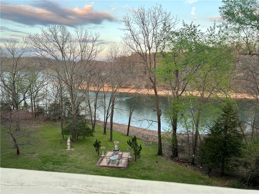 This Stunning 6BR, 3-Level LAKEFRONT Retreat blends Elegance & Comfort with Cathedral Ceilings, Double Spiral Staircases, & a Dramatic 2-Story Wall of Windows showcasing Peaceful Beaver LAKEVIEWS. Multiple Living Areas, Formal Dining, Sitting Room, Walk-Out Basement, & 3-Car Garage provide ample Space for Living & Entertaining. Outdoor Spaces feature Brick Patios, Lush Lawn, & a Lakeside Garden Terrace with Fountain & Seating – a Magical spot to unwind by the water. A flat walkway leads to your BOAT SLIP in Community Dock, w Prairie Creek Marina just around the corner. Nestled in a welcoming neighborhood yet minutes From dining, shopping, & entertainment in Rogers, this Home Perfectly blends Lake Life & City Convenience.
