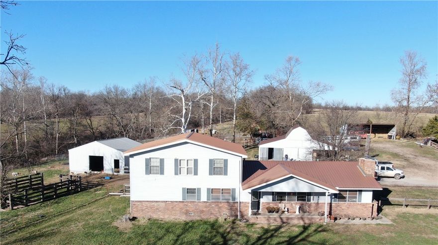 Country living at its finest! The home features 3,150 sq. ft. with 4 large bedrooms, 2 living areas, one with a wood-burning fireplace. Oversized master bed and bath on the second level. Perfectly laid out kitchen/dining area with a new built-in oven and cooktop. Outside, you will find a 30x30 shop, 30x40 barn with a lean-to, an equipment shed, and 3 loafing sheds for livestock. 29 acres all fenced and ready to turn out livestock. Approximately 20 acres of pasture, and the rest is timber with an abundance of wildlife for hunting. Property is located only 30 minutes from Bentonville, AR., and 20 minutes to Grand Lake. Owner will divide and sell more or less acreage with the home.
