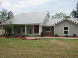 MOTHER-IN-LAW QUARTERS. Stylish contemporary (w/ full list updates in documents), nothing has been left to be done. Come see the new kitchen w/ island, granite counter tops, lg master w/ huge walk in, beautiful staircase overlooking the 2 story living area featuring a stone fireplace. This 3/2 home features a nicely done mothers in laws quarters, shop and decks for relaxation all on 1.45 acres.