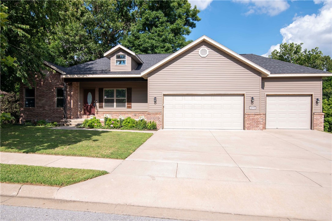 Incredible walk-out basement home in a wonderful Pea Ridge neighborhood. Split design with three bedrooms on the main floor and one on the lower level. Open concept living on the main level with cathedral ceilings. Crown molding, custom trim and beams and beautiful cabinetry. Deck on main level and covered patio from your walk-out basement. Basement has large storage areas, Come see this beautiful home with a walk-out and finished basement. Over-sized three car garage. There are not many like this in NWA. Motivated Seller!!!
