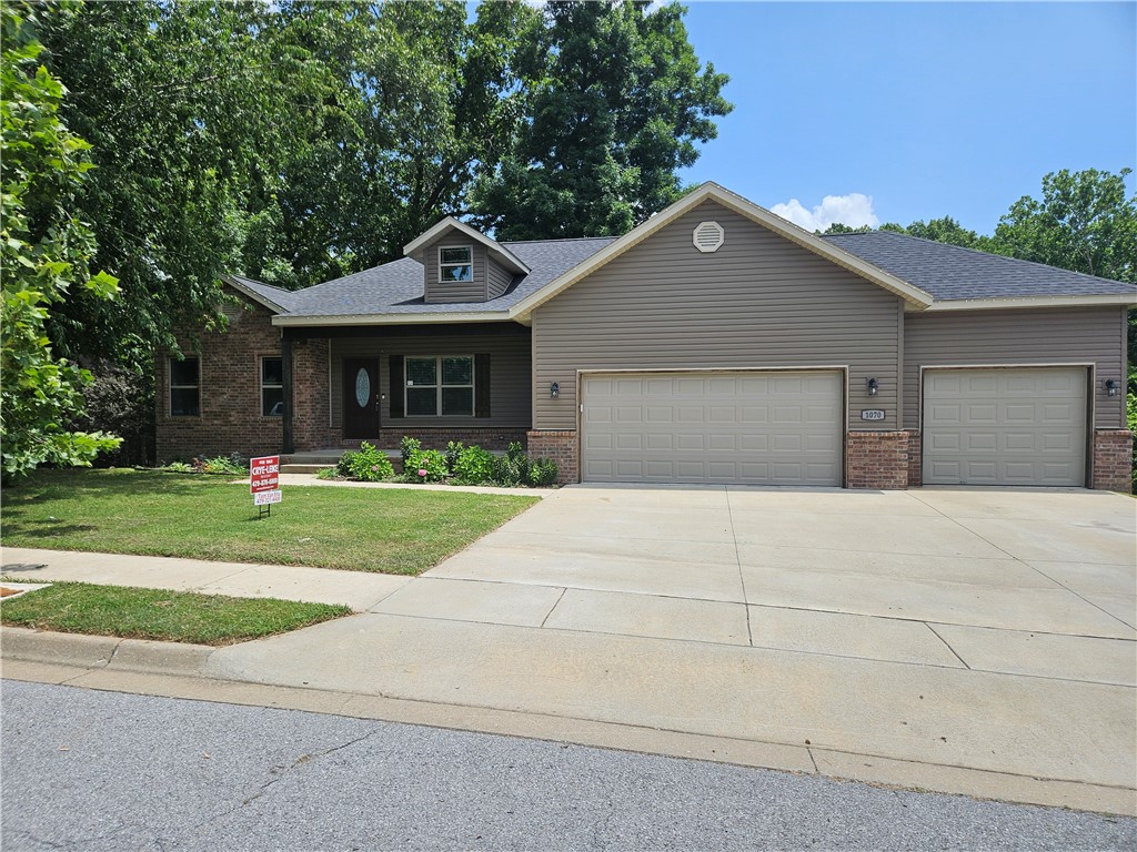 Incredible walk-out basement home in a wonderful Pea Ridge neighborhood. Split design with three bedrooms on the main floor and one on the lower level. Open concept living on the main level with cathedral ceilings. Crown molding, custom trim and beams and beautiful cabinetry. Deck on main level and covered patio from your walk-out basement. Basement has large storage areas, Come see this beautiful home with a walk-out and finished basement. Over-sized three car garage. There are not many like this in NWA. Professional Pictures coming Soon!