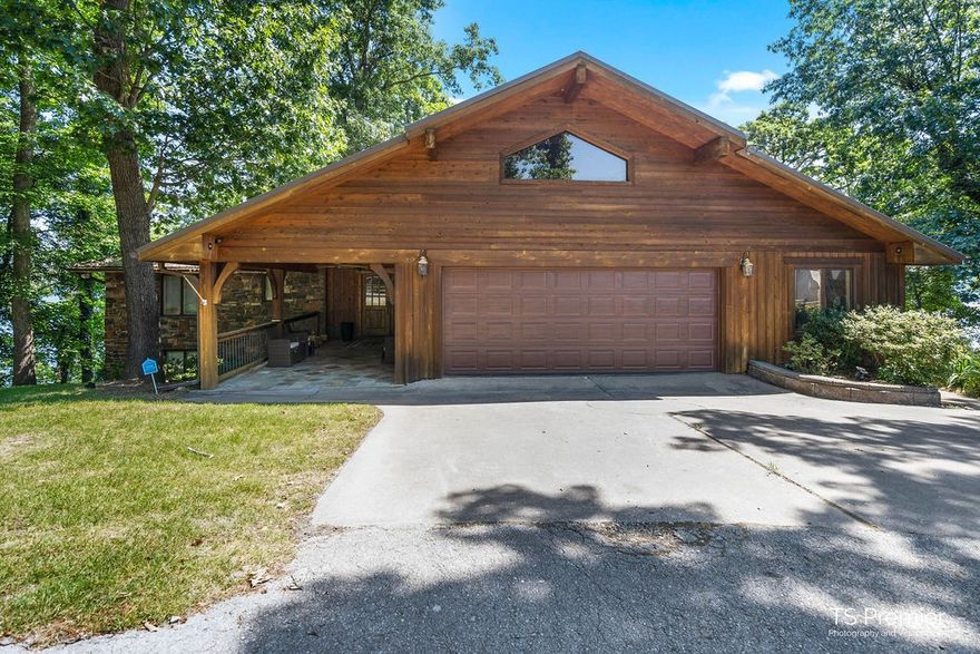 Rare Beaver Lake opportunity in perfect location!  Amazing 180 degree view from 2 private decks overlooking the lake. Boating, jumping off the dock, or enjoying a book on the deck, this lakeview home will allow you to enjoy the things you love to do. This home has 360' of shore line, two slips and 1-lift in a community dock within walking distance!  4 bedroom 2-1/2 bath with full walk out basement.  Make the lake-style your new lifestyle. This home is truly a must see!