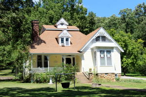 Historic home on 5.5 acres in Yellville with detached 3 car garage. This home has been restored to its original look of the early 1900's. Stained glass, authentic fixtures and hardware through-out. Large kitchen with fireplace and breakfast nook, grand entry with high ceilings in the foyer that take you to the formal dining room or great room and pocket doors that open to the great room. One bedroom one bath on main level and one bedroom one bath up stairs with potential third bedroom.