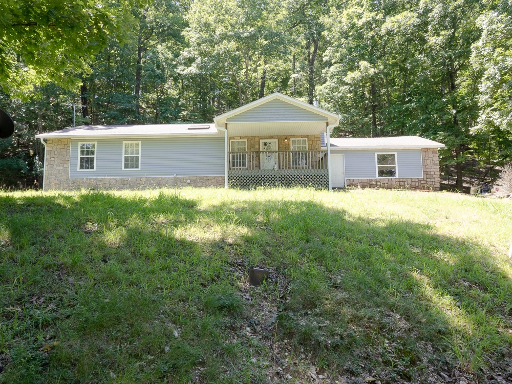 Come and see this single level 3/2 with attached garage in Lost Bridge Village, 30 minutes from Rogers and 45 from Eureka Springs. Near Beaver Lake, this home is close to the Lost Bridge clubhouse, library, swimming pool and boat ramp! Get out of the big city and live the lake life near Beaver Lake in Lost Bridge Village! House comes with an extra lot! Public water and sewer, house needs flooring and some refreshing to make it your own! New roof shingles in 2024! Whole house Generac generator runs on propane in times of need.