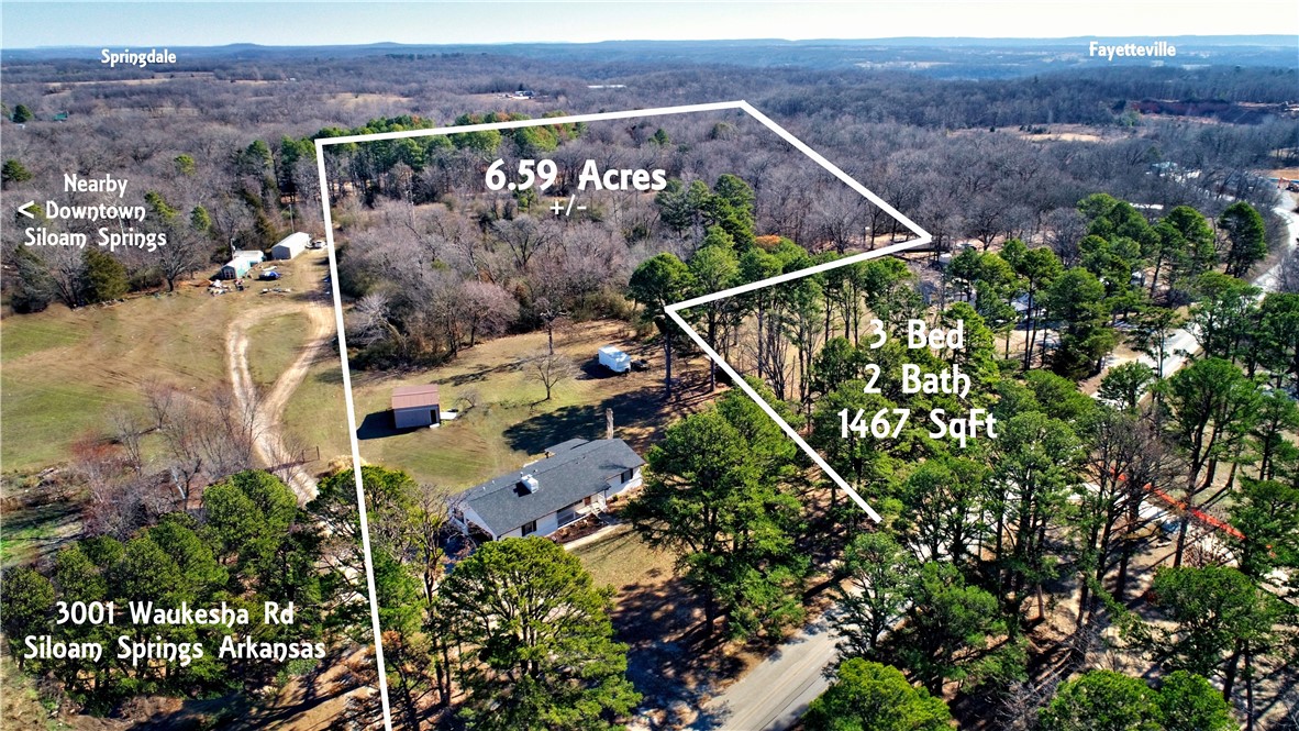 Price reduced 5-30-25 . Three-bedroom, two-bath, two-car garage home on 6.59 acres just outside town. New roof 2023, oak flooring, covered porch. New flooring is throughout, and the fully remodeled kitchen includes new cabinets & wooden countertops. There is a wood-burning fireplace in the living room. Has a detached 20' x 16' workshop.
Pool has been removed.
Just 1 mile from Highway 412 & 2 miles from Walmart & 3 miles to historic downtown Siloam Springs.