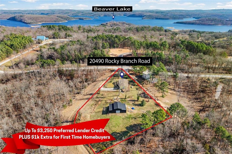 Welcome to 20490 Rocky Branch Road – a rare 1.4± acre hobby farm at the top of the mountain with seasonal lake views and FLAT usable space! Plenty of room to roam. This 3 bed, 2 bath home offers 1,360 sq ft of updated living space. The kitchen was fully renovated in 2024 with new cabinets, new stove/oven, quartz countertops, modern sink, and backsplash. The guest bath was also updated with new cabinets, quartz counters, and toilet. Wood floors run throughout with LVP in wet areas. New roof 2024, newer and 2 water heaters. Outside, enjoy a landscaped yard, firepit area with 5 Adirondack chairs (to convey), and space for a small pool. A 41’x30’ shop with two 8’x10’ roll-up doors and side entry offers excellent workspace which includes electricity & partial insulation. You'll find another smaller shed for storage. Less than 5 minutes to Rocky Branch Marina on Beaver Lake. Peaceful setting with modern updates—ideal for hobby farming, weekend getaways, or full-time living!