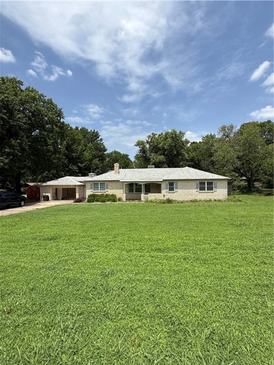 Sixty feet from Razorback Transit stop. Great for students or a family with plenty of room for multiple cars to park. A bonus room can be turned into a fourth bedroom.