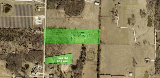 Hardwoods, paved road, and room to build—this 2.5-acre tract on Wedington Blacktop checks all the boxes. With electric at the road, city water from Lincoln and multiple build sites, it's a solid start for your dream home. Gently sloping, partially fenced, and surrounded by nature, but still just minutes from shopping and dining. No mobile or manufactured homes allowed. There has been perc tested for building a home.