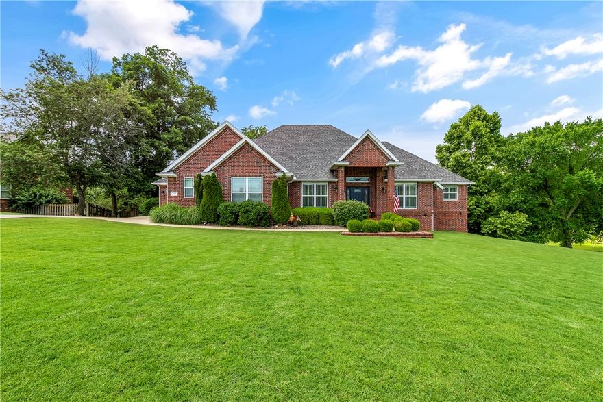 Spacious retreat in the heart of Cave Springs setting on 1.09 acres with over 4,800 sq ft of living space.  This beautifully appointed 4-bedroom offers the perfect blend of privacy, space, and convenience all within the coveted Bentonville School District.  From plantation shutters to a full central vac system, every detail is designed for comfortable, luxurious living.  Step inside to discover a thoughtful layout featuring your custom kitchen, formal dining room.  On the lower-level, ideal for multigenerational living & looking at your backyard oasis.