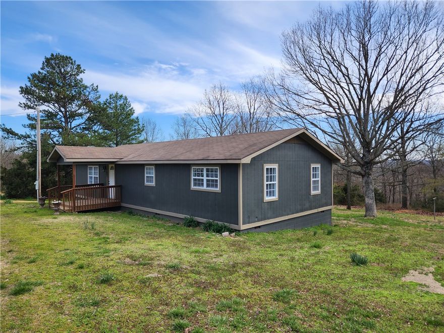 If you are looking for some privacy, here it is.  1,300 square foot home sitting on 5.11+/- acres with a shop! There is a little bit of everything on the property.  Pasture for some animals or a garden, grass for a great yard, a pond, and woods behind for privacy and/or hunting.  Land isn't steep at all but has a bench area, perfect for animal traffic.  Second house at the end of this County Road but still only 23 minutes to Huntsville, Kingston, or Marble.  This 3 bedroom/ 2 bath home has recently had the interior painted and a new water tank installed.  Just tapped into Madison Rural water and used to be on a well so, potentially, have access to multiple water sources if interested.  Perfect home in the country, weekend getaway, and has even been used as an income producing rental property.