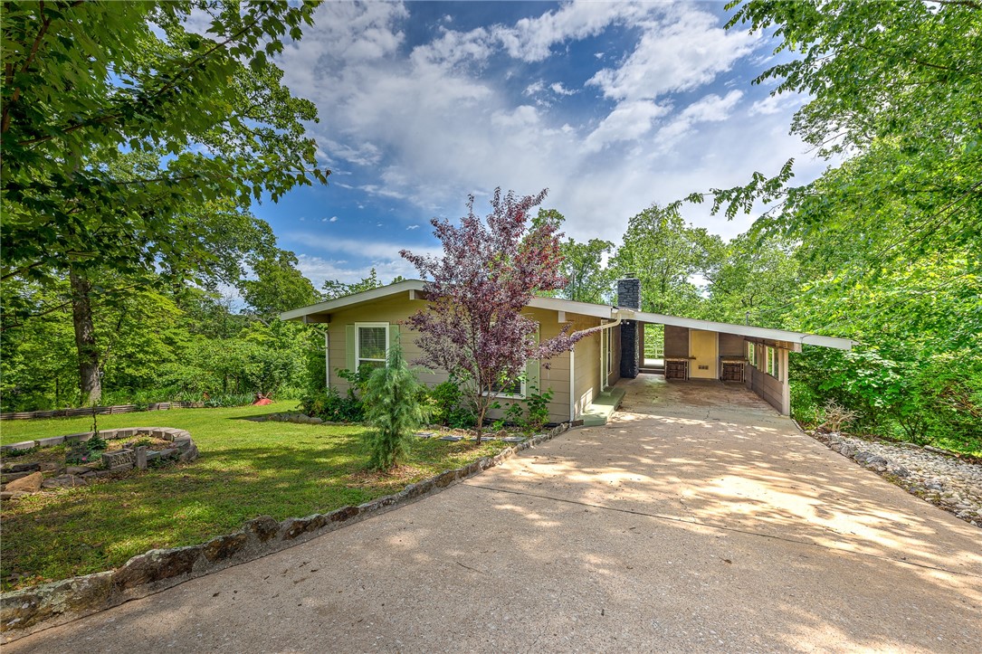 Back on the market. No fault of seller.
Welcome to 12 Brightling Ln! Situated on a generous .7-acre double lot, this charming 3 bed, 2 bath home is perfectly positioned down the street from the scenic Lago Vista trail and the serene Lake Avalon Beach. Nature enthusiasts will delight in the short drive to Tanyard Creek Nature Trail, while golf aficionados will appreciate the proximity to Bella Vista Country Club.
This cozy abode boasts spacious living areas filled with natural light and a beautiful stone fireplace, creating an inviting atmosphere for both relaxation and entertainment.
Outside, the property's expansive .7-acre lot offers ample space for outdoor enjoyment, whether it's hosting barbecues on the decks or simply enjoying the lush surroundings. This property also offers abundant outdoor storage space, perfect for keeping your belongings organized and easily accessible.
Don't miss the chance to make this delightful home yours and experience the best of Bella Vista living!