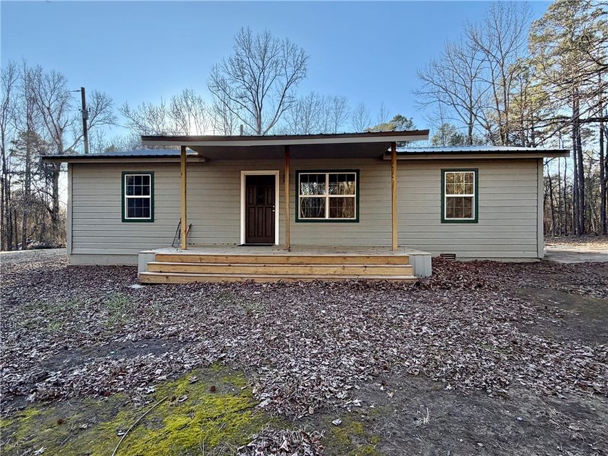 Welcome to 138 Anderson Lane in Delaware — a fully remodeled 3-bedroom, 2-bath home offering approximately 1,300 sq ft of updated living space on roughly 3 secluded acres. This peaceful country retreat features a new metal roof, new flooring, fresh paint, new windows, updated lighting, new tubs, modern fixtures, and a tankless water heater for added efficiency and comfort.

Enjoy quiet mornings on the covered porch surrounded by serene views and wide-open space. With plenty of room to garden, explore, or simply unwind, this property is perfect for those seeking privacy and country living.

Located just minutes from outdoor recreation at Lake Dardanelle and the popular Lion's Den Golf Course, you’ll have the best of nature and golf right at your doorstep. Modern updates, peaceful setting, and move-in ready — don’t miss this opportunity!