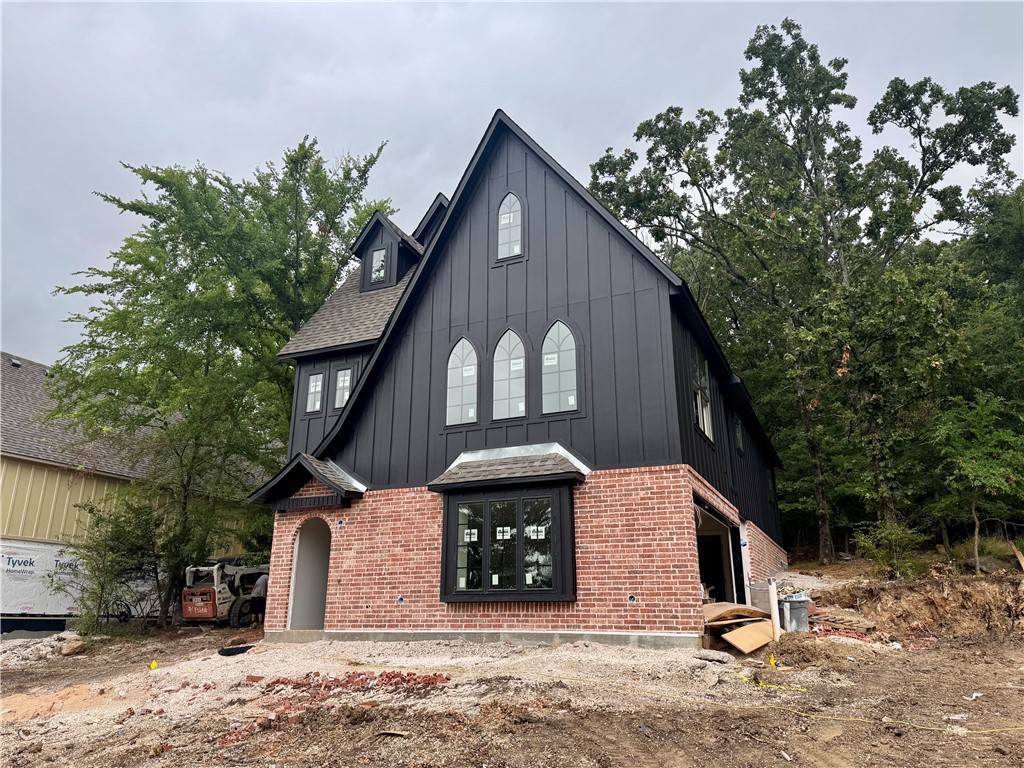Introducing a truly one-of-a-kind new construction home! This stunning three-story gothic style home features 3 bedrooms and 3.5 bathrooms, offering thoughtful details throughout. The heart of the home is the open-concept second floor, where the kitchen, dining, and living areas flow seamlessly—perfect for everyday living and entertaining. Step out onto the spacious outdoor deck off the kitchen for easy indoor-outdoor living.
The lower level features a versatile, climate-controlled space offering excellent potential for future customization. While currently designated for storage or mechanical use, it is thoughtfully designed to accommodate a future bathroom and can be transformed into a home office, fitness area, guest suite, or other functional living space.
Outside, the home makes a statement with its rich black siding paired with classic Old Colonial red brick, accented by gorgeous black arched windows.