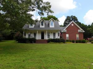 Talk about curb appeal... and back yard for days!! This house is so beautiful outside you won't be able to resist checking it out! Once inside you'll be drawn in by the soaring cathedral ceilings, hardwood floors, tons of natural light, granite counters, double ovens and so much more! Looking for a little land? You'll love this 5 acre lot with two outbuildings! Covered front and back porches are the perfect spot to relax or entertain. Hurry, you'll want to schedule your tour today.