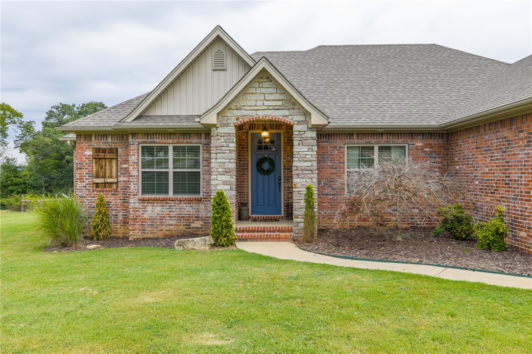 Welcome to this stunning one-level home with a split floor plan on 1.36 peaceful acres in a friendly community. With room to spread out, including a three-car garage, this property has it all. Step inside to an inviting open layout with a cozy gas fireplace and thoughtful finishes. The kitchen is the heart of the home with an oversized butcher block island, farmhouse sink, pot filler, granite countertops, and ice machine. Barn doors highlight the home office. The primary suite offers an en suite with dual sinks, walk-through shower, soaker tub, and large walk-in closet. Additional bedrooms have new carpet and share a Jack & Jill bath. Outdoor living includes a saltwater pool, spacious entertaining area, and a garden spot with blackberry bushes. A 576 sq ft detached shop with studio apartment adds versatilityāideal for a man cave, guest space, adult children, or in-law suite. Updates include a 2023 roof and ventilation system for peace of mind.
